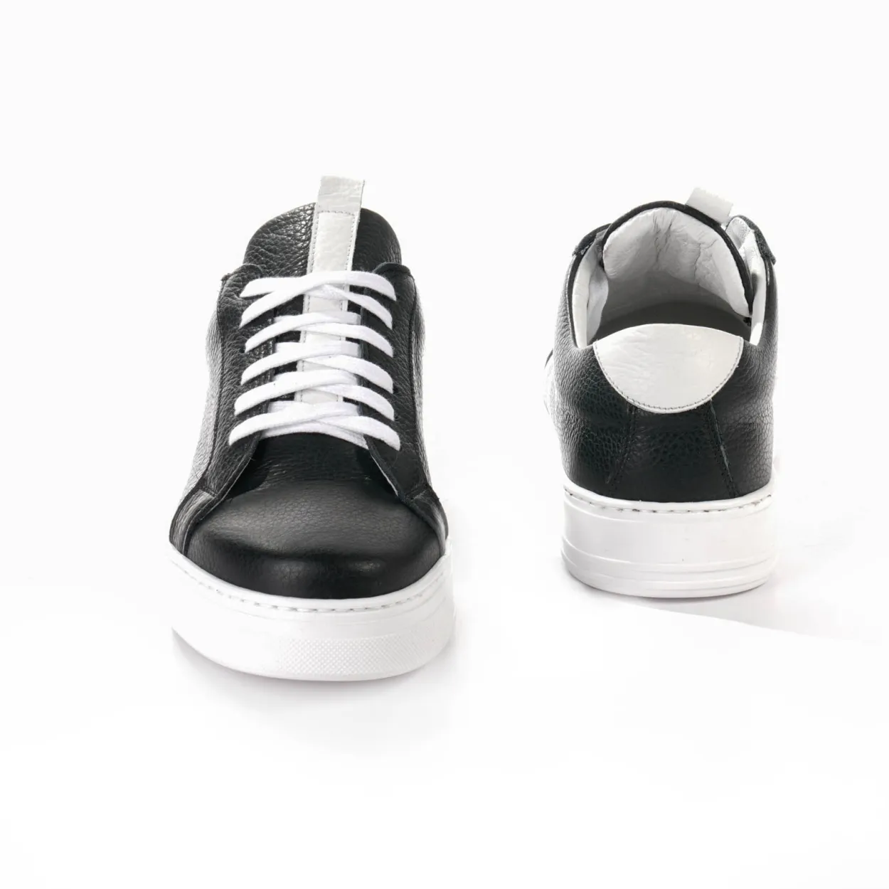 White wedge sneakers by Andrea Nobile.